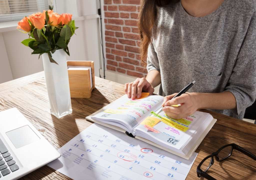 Woman at a desk pondering How to Delegate Better